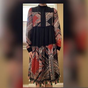 Classy dress. Gorgeous print. Easy to move around in. Worn at nicer occasions.